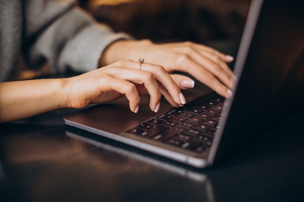 Female hands typing on computer keyboard