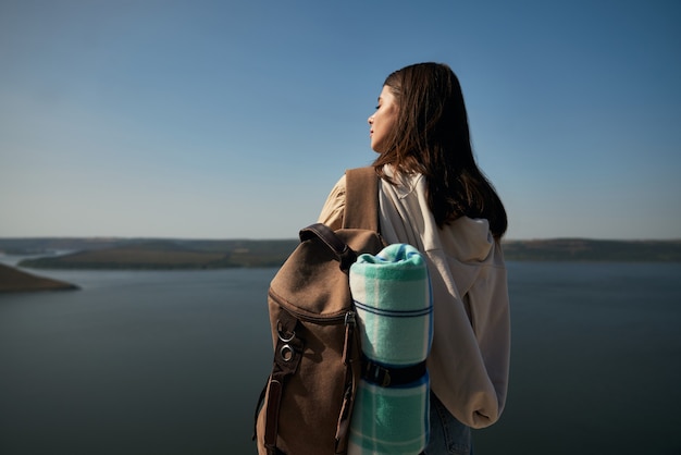 Free photo female hiker enjoying sunny weather at bakota area