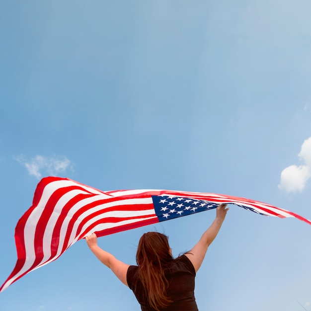 Female holding American flag