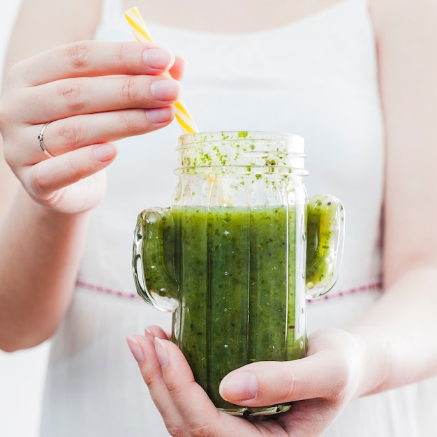 Free Photo female holding jar with healthy smoothie