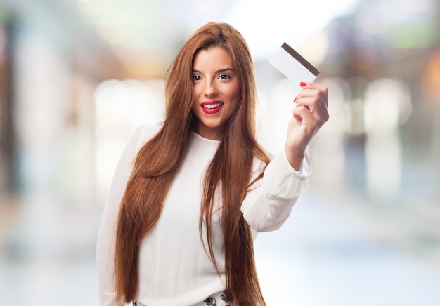 Female holding small card