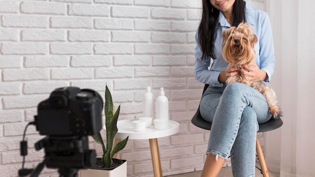 Female influencer at home with dog