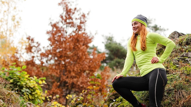 Female jogger resting low view