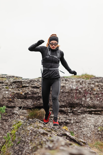 Female jogger running front view