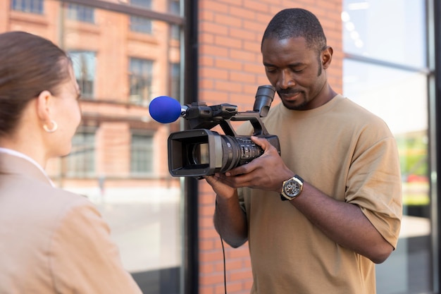 Female journalist telling the news outside