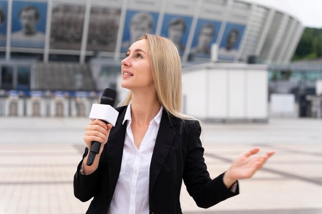 Female journalist telling the news