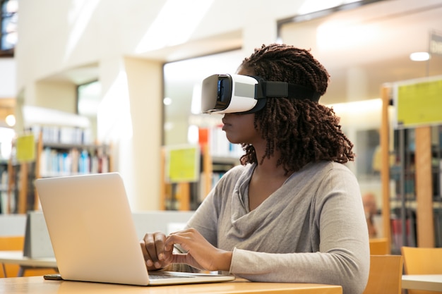 Female library user watching virtual video