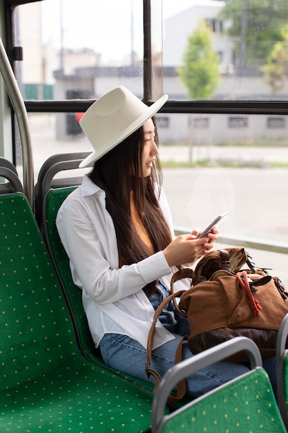 Female local traveler staying in a bus