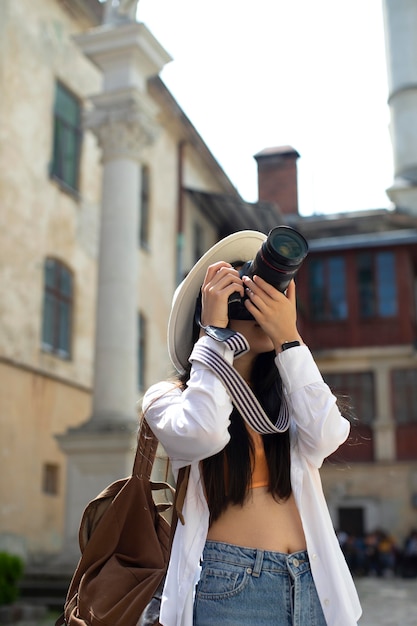 Free photo female local traveler with a camera