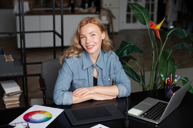 Free photo female logo designer working in her office