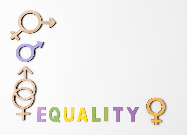 Free photo female and male gender symbols with equality lettering and copy space