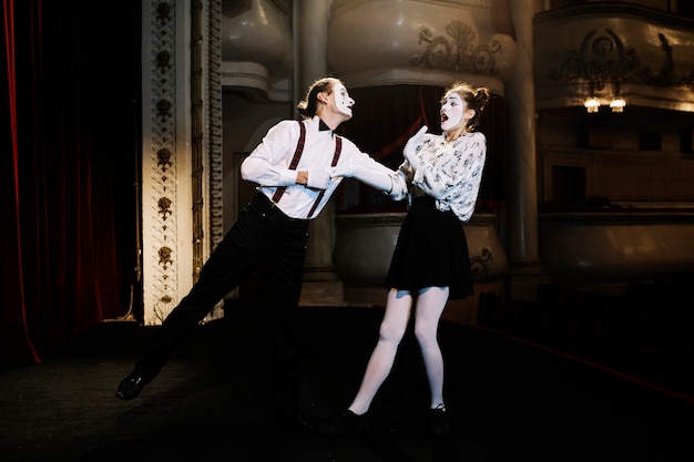 Free photo female and male mime artist performing on stage