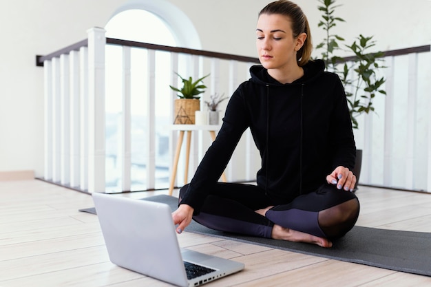 Female meditating indoor