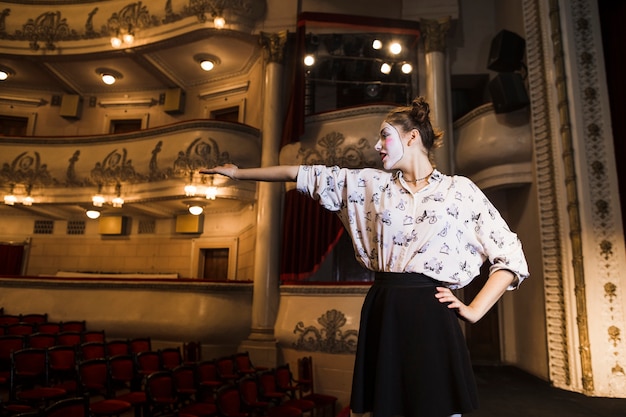 Female mime rehearsing on stage