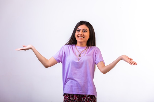 Female model opening her arms and smiling.