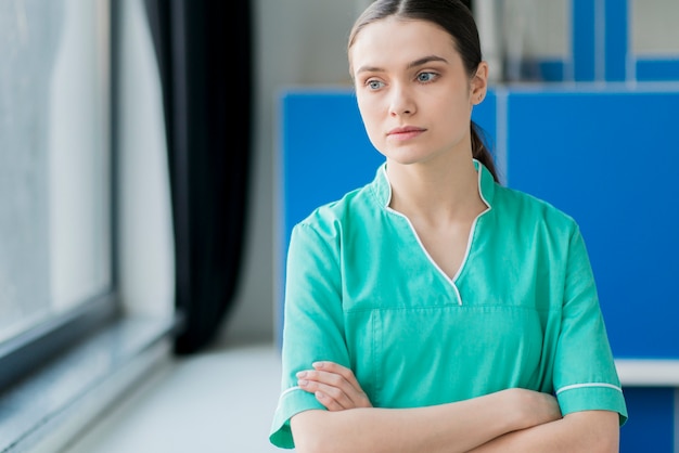 Free photo female nurse with arms crossed