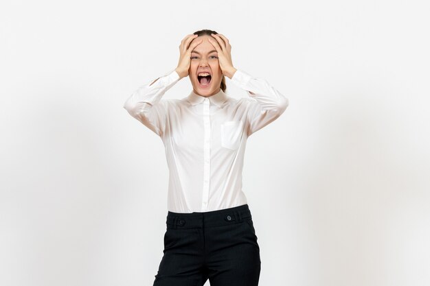 female office employee screaming in white blouse on white