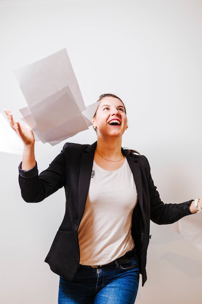 Free Photo female office employee throwing up papers