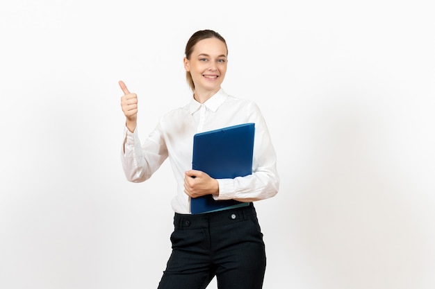 female office employee in white blouse holding documents on white