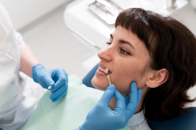 Female patient having a procedure done at the dentist