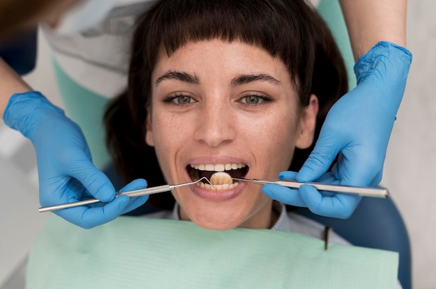 Female patient having a procedure done at the dentist