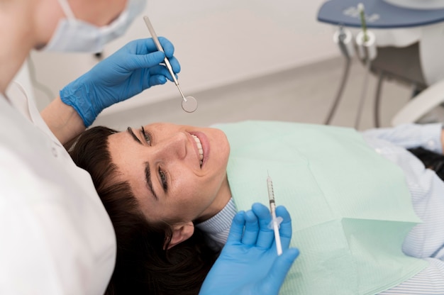 Female patient having a procedure done at the dentist