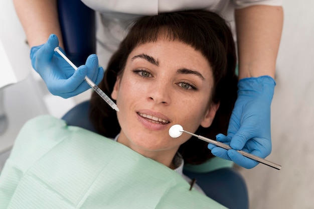 Female patient having a procedure done at the dentist