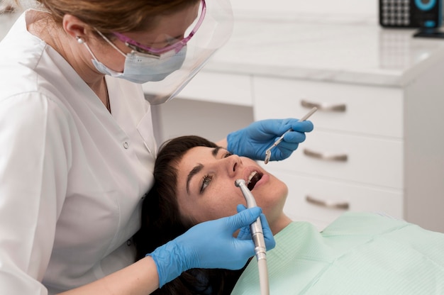 Female patient having a procedure done at the dentist