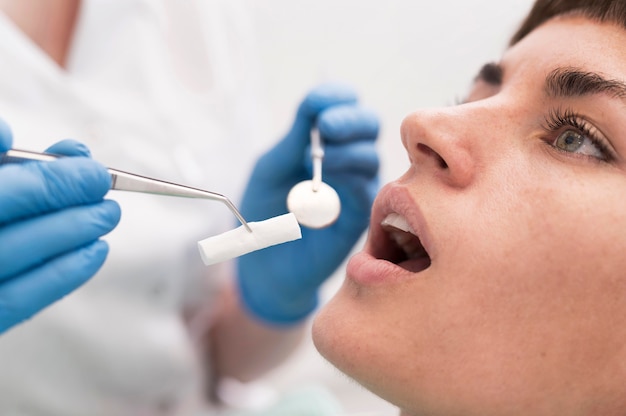 Female patient having a procedure done at the dentist