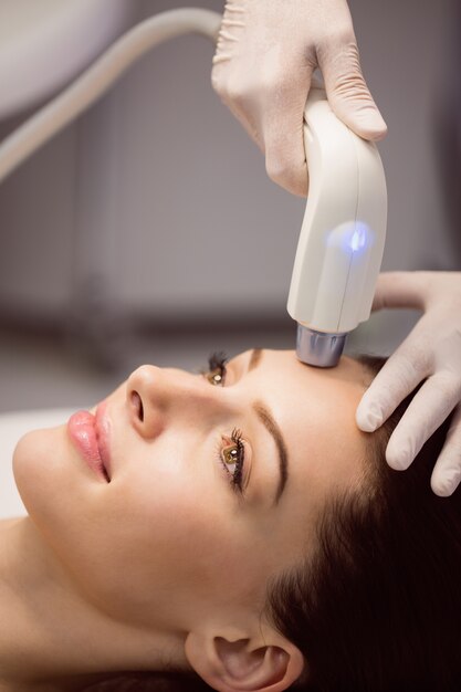 Female patient receiving cosmetic treatment