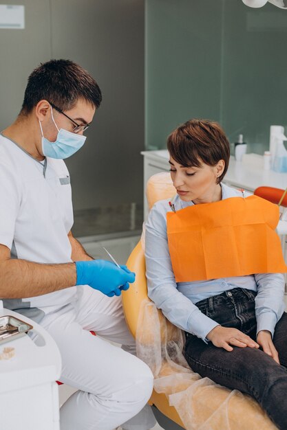 Female patient visiting dentist at clinic