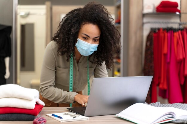 Female personal shopper with mask working