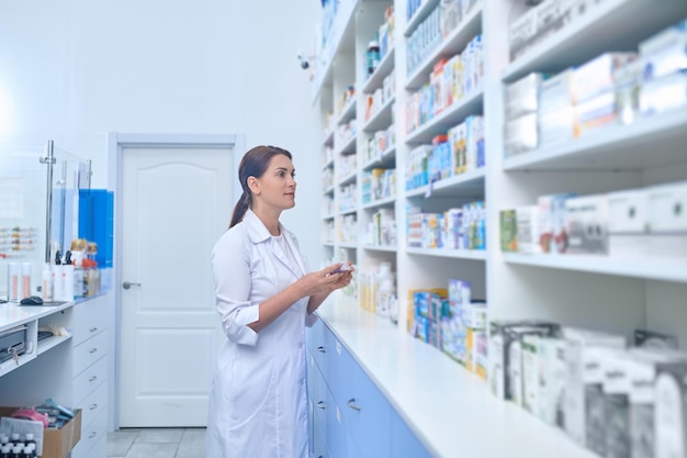 Free photo female pharmacist working in a drugstore