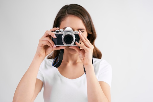 Female photographer with camera photographing