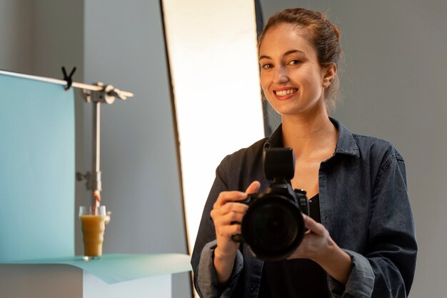 Female product photographer in studio