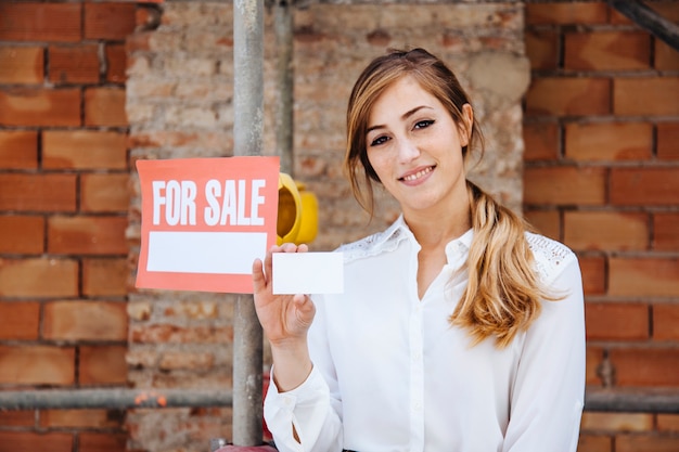 Female real estate agent at construction site