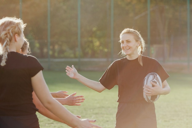 Female rugby player saluting her team mates