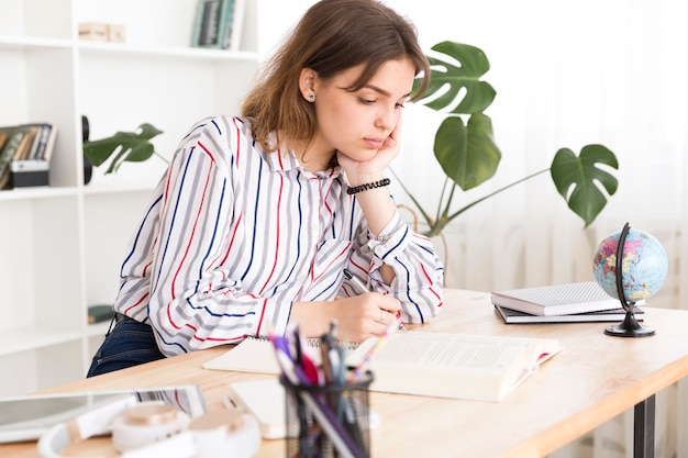 Female student busy with homework