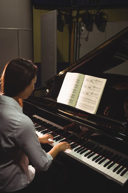 Female student playing piano