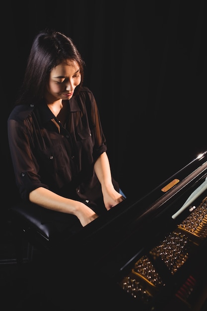 Female student playing piano