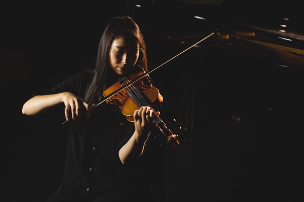 Female student playing violin