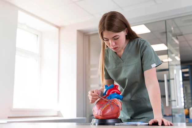 Free Photo female student practicing medicine