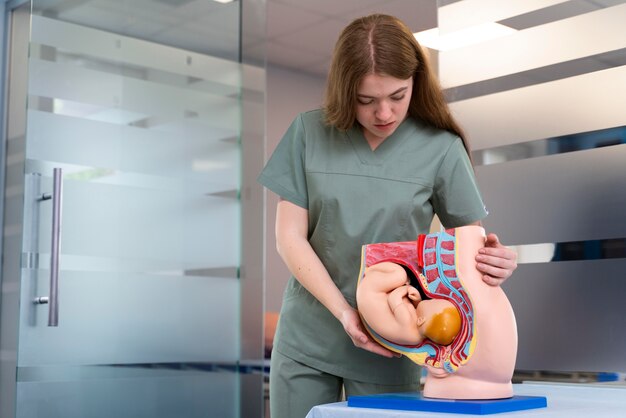 Female student practicing medicine