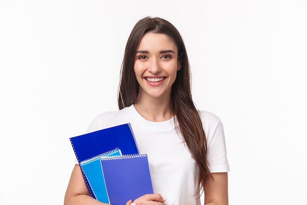 Free photo female student with books and paperworks