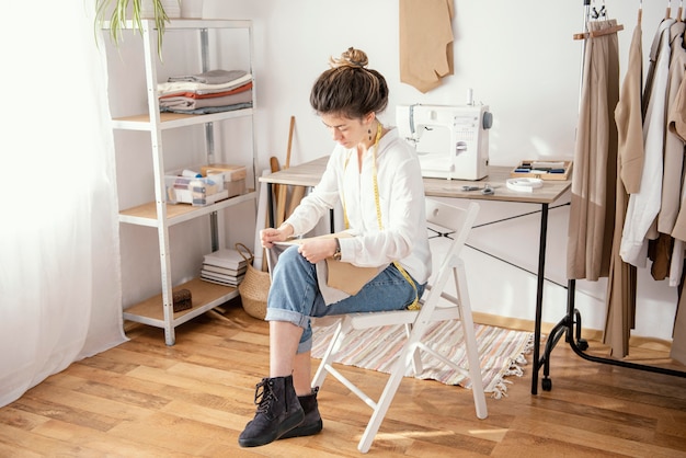 Female tailor working in the studio