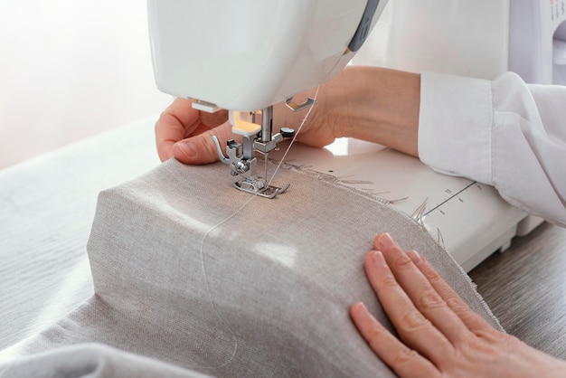 Female tailor working with sewing machine