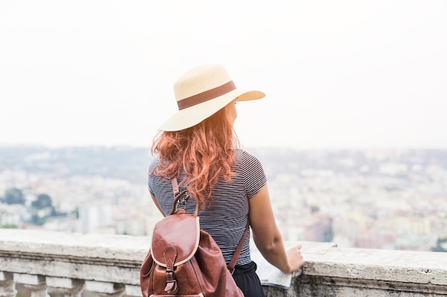 Free Photo female tourist looking at city