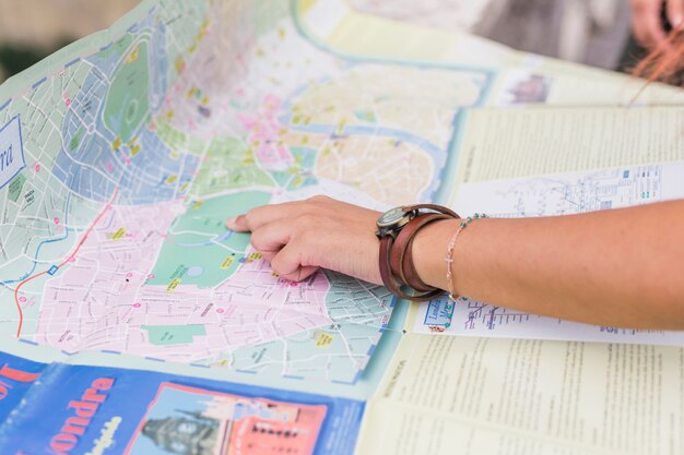 Female tourist looking at map