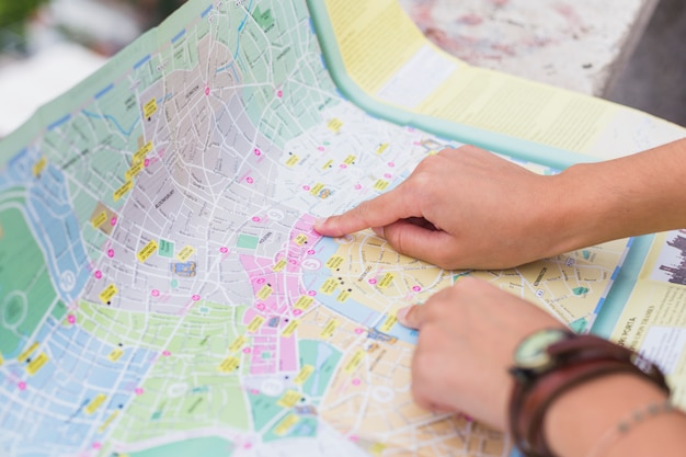 Female tourist looking at map