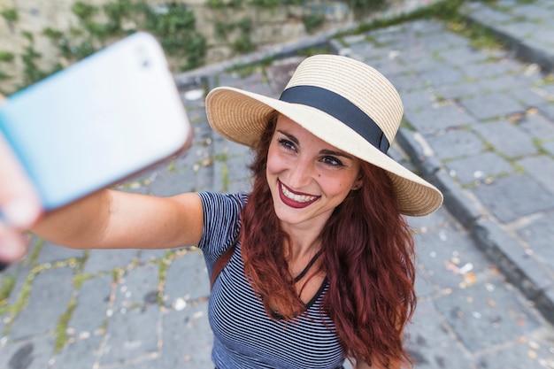 Free Photo female tourist taking selfie